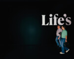 Paar geht an "Life's" Schriftzug vorbei.